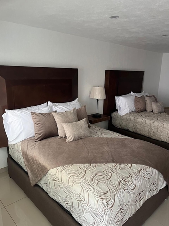 Imagen de la habitación del Hotel La casa de las palmeras. Foto 4