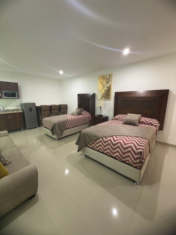 Imagen de la habitación del Hotel La casa de las palmeras. Foto 8