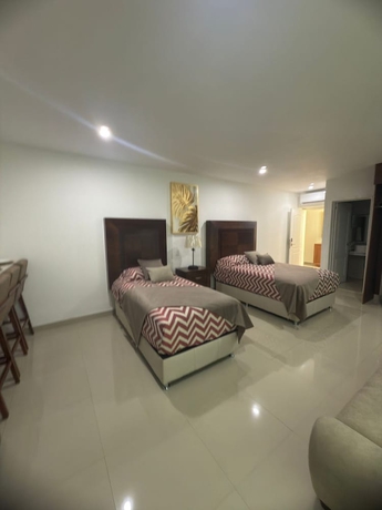 Imagen de la habitación del Hotel La casa de las palmeras. Foto 9