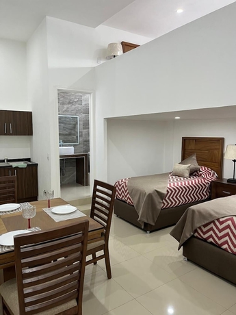 Imagen de la habitación del Hotel La casa de las palmeras. Foto 13