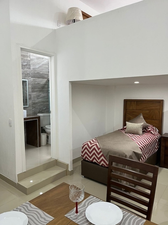 Imagen de la habitación del Hotel La casa de las palmeras. Foto 14