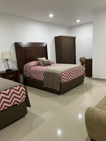 Imagen de la habitación del Hotel La casa de las palmeras. Foto 15