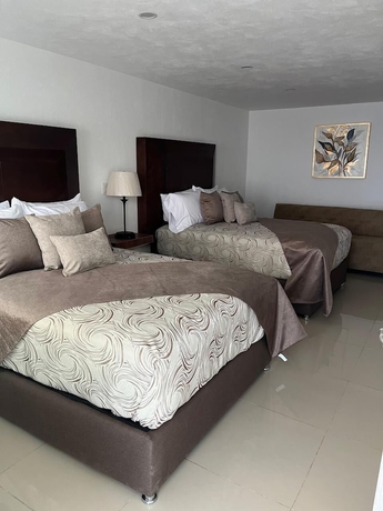 Imagen de la habitación del Hotel La casa de las palmeras. Foto 16