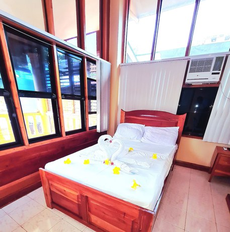 Imagen de la habitación del Hotel La-Familia Guest House. Foto 7