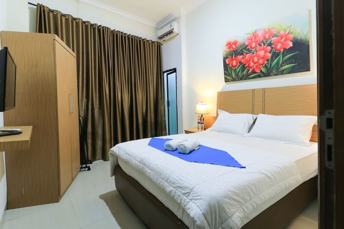 Imagen de la habitación del Hotel Labuana Homestay and Cafe Garden. Foto 4