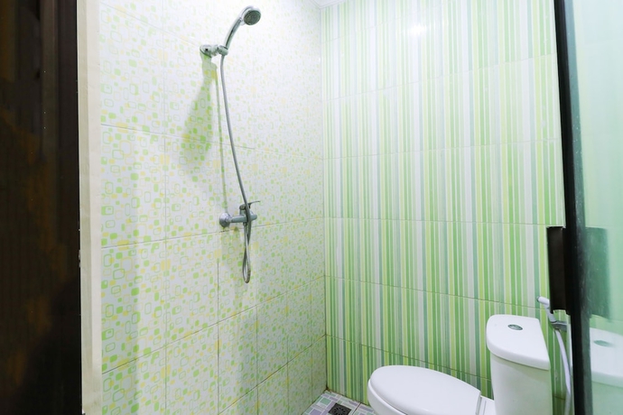 Imagen de la habitación del Hotel Labuana Homestay and Cafe Garden. Foto 8