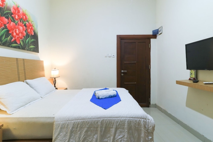 Imagen de la habitación del Hotel Labuana Homestay and Cafe Garden. Foto 9