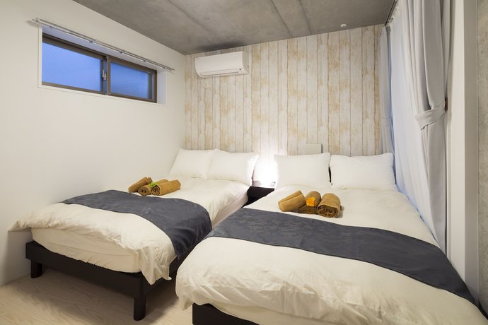 Imagen de la habitación del Hotel Laffitte Hirai Condominium Hotel. Foto 9