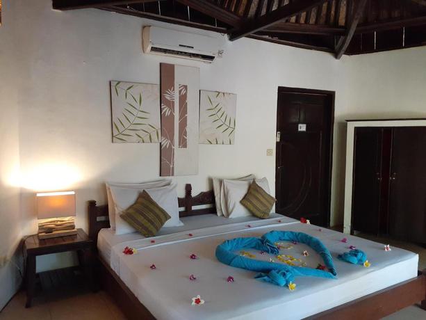 Imagen de la habitación del Hotel Laguna Gili Beach Resort. Foto 18