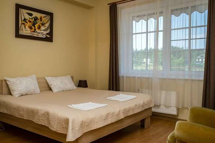 Imagen de la habitación del Hotel Laguna House. Foto 16