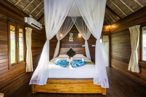 Imagen de la habitación del Hotel Laguna Reef Huts. Foto 7