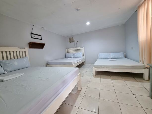 Imagen de la habitación del Hotel Laiya Riviera by Yemaya powered by Cocotel. Foto 13