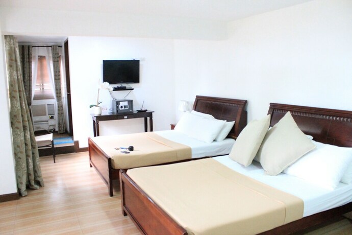 Imagen de la habitación del Hotel Laiya White Cove Beach Resort. Foto 27