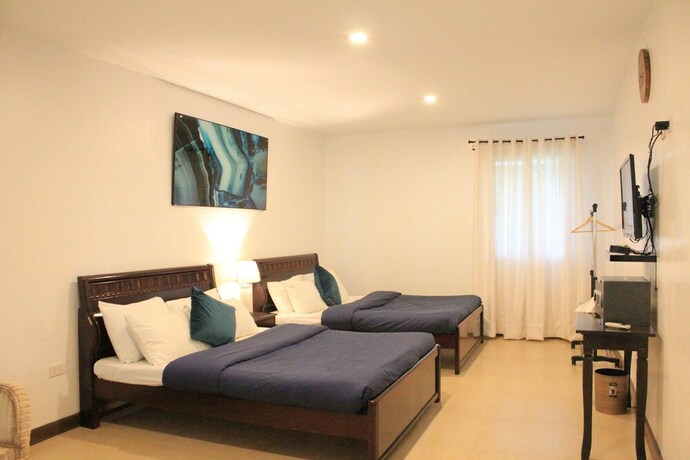 Imagen de la habitación del Hotel Laiya White Cove Beach Resort. Foto 32