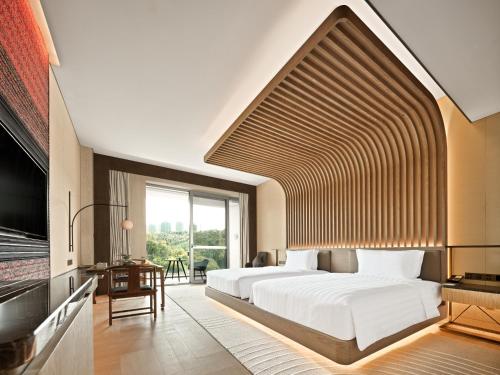 Imagen de la habitación del Hotel Lakeview Yulongwan Kunming. Foto 15