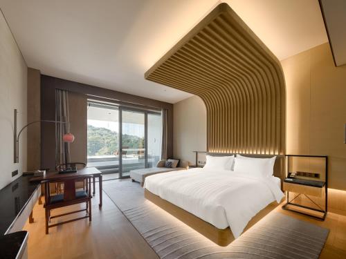 Imagen de la habitación del Hotel Lakeview Yulongwan Kunming. Foto 19