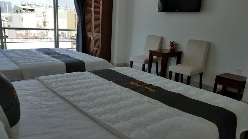 Imagen de la habitación del Hotel L'amour Saigon Hotel. Foto 7