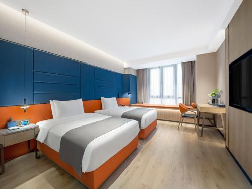 Imagen de la habitación del Hotel LanOu Changsha Wuyi Square. Foto 16