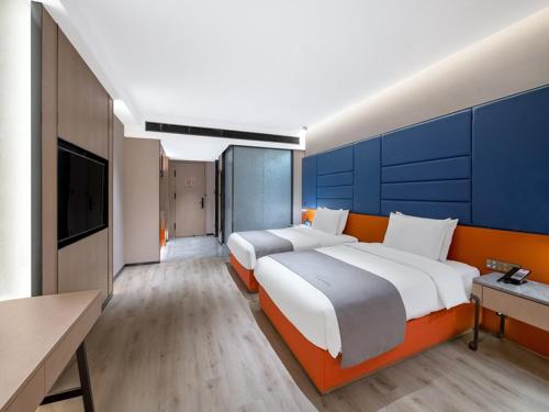 Imagen de la habitación del Hotel LanOu Changsha Wuyi Square. Foto 18