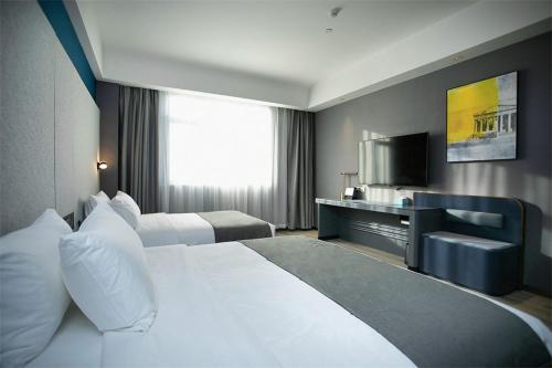 Imagen de la habitación del Hotel LanOu Huai\'an Lianshui High-Speed Railway Station Yanhuang Avenue. Foto 14