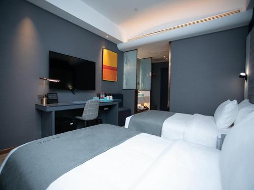 Imagen de la habitación del Hotel LanOu Huai\'an Lianshui High-Speed Railway Station Yanhuang Avenue. Foto 16