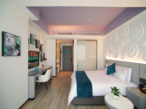 Imagen de la habitación del Hotel LanOu International Rizhao University Town. Foto 12