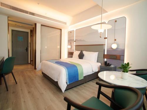 Imagen de la habitación del Hotel LanOu International Rizhao University Town. Foto 14
