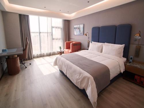 Imagen de la habitación del Hotel LanOu International Rizhao University Town. Foto 15