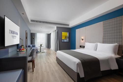 Imagen general del Hotel LanOu International Xishuangbanna Jinghong Gaozhuang. Foto 2