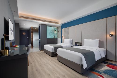 Imagen general del Hotel LanOu International Xishuangbanna Jinghong Gaozhuang. Foto 12
