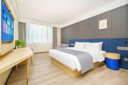 Imagen de la habitación del Hotel LanOu Jingzhou High-Speed Railway Station Fangte Oriental God Painting. Foto 20