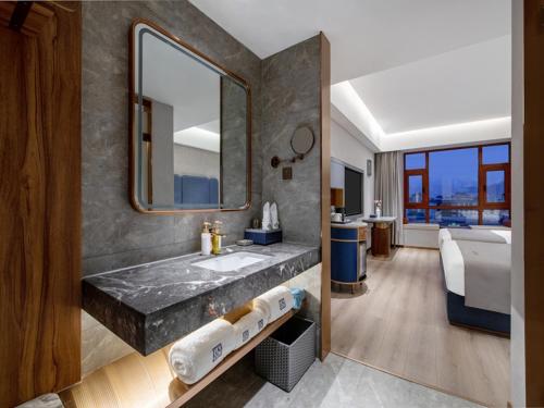 Imagen de la habitación del Hotel LanOu Lhasa Municipal Government Tibet University. Foto 15