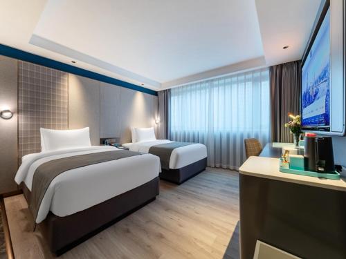 Imagen de la habitación del Hotel LanOu Shenzhen Luohu Ruipeng Building. Foto 15
