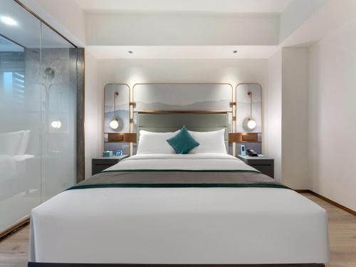 Imagen de la habitación del Hotel LanOu Shenzhen Luohu Ruipeng Building. Foto 19