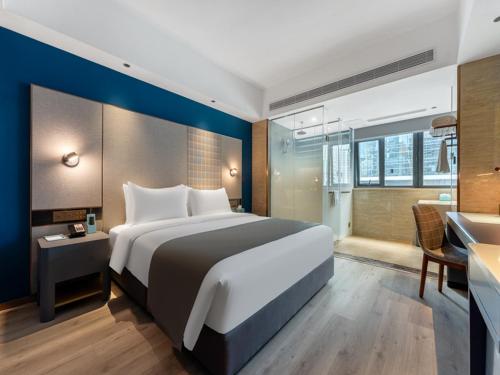 Imagen de la habitación del Hotel LanOu Shenzhen Luohu Ruipeng Building. Foto 20