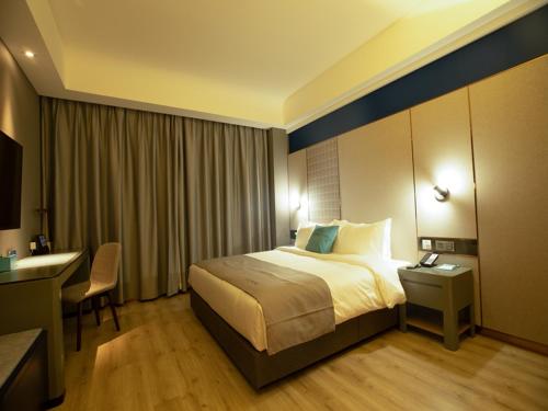 Imagen de la habitación del Hotel LanOu Weinan Fuping Millennium Longlano. Foto 14