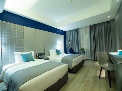 Imagen de la habitación del Hotel LanOu Weinan Fuping Millennium Longlano. Foto 17