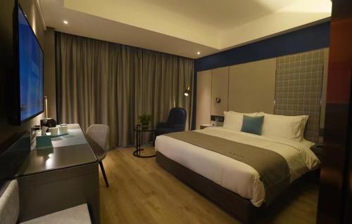 Imagen de la habitación del Hotel LanOu Weinan Fuping Millennium Longlano. Foto 20