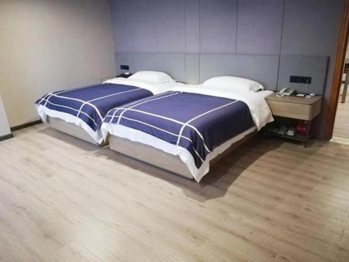 Imagen de la habitación del Hotel LanOu Xilinhot China Madu Cultural Plaza. Foto 12