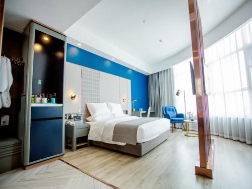 Imagen de la habitación del Hotel LanOu Zhengzhou Dengfeng Songshan Shaolin Cultural City. Foto 17