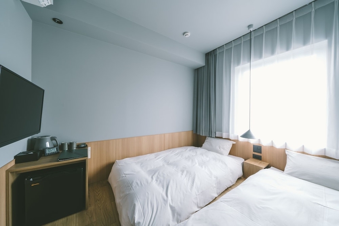 Imagen de la habitación del Hotel Landabout Tokyo. Foto 2