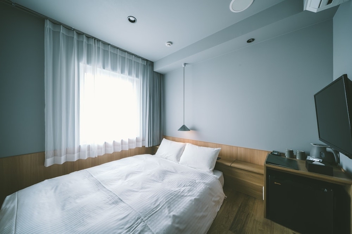 Imagen de la habitación del Hotel Landabout Tokyo. Foto 10