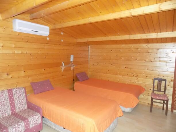 Imagen de la habitación del Hotel Land's Hause Bungalows. Foto 13