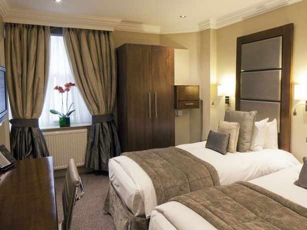 Imagen de la habitación del Hotel Langham Court. Foto 7