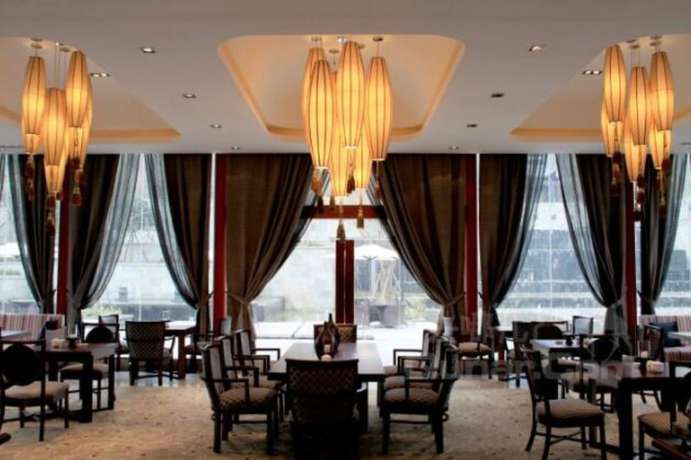 Imagen del bar/restaurante del Hotel Langzhong Hirizon Hotel. Foto 2