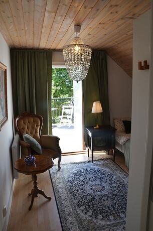 Imagen de la habitación del Hotel Lanthotell L&ouml;gn&auml;s G&aring;rd. Foto 22