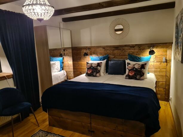 Imagen de la habitación del Hotel Lanthotell L&ouml;gn&auml;s G&aring;rd. Foto 27