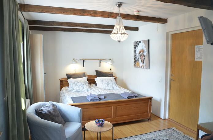 Imagen de la habitación del Hotel Lanthotell L&ouml;gn&auml;s G&aring;rd. Foto 28