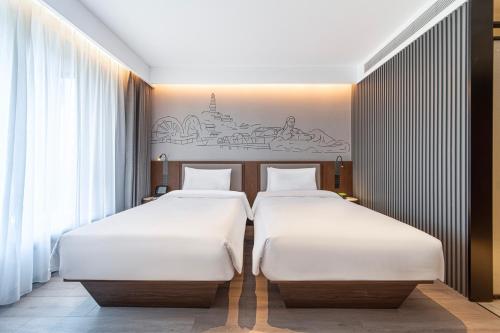 Imagen general del Hotel Lanzhou Xiguan Cross Zhongshan Bridge Yifei. Foto 3