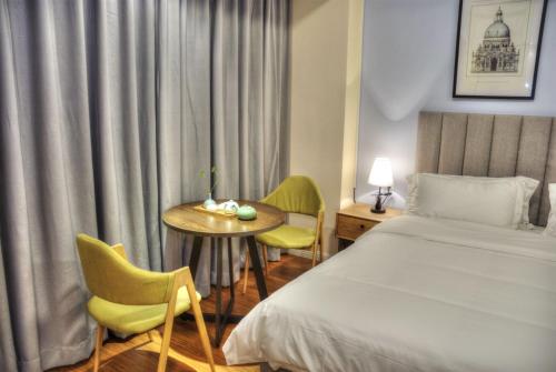 Imagen de la habitación del Hotel Lanzhu Boutique Hotels. Foto 7